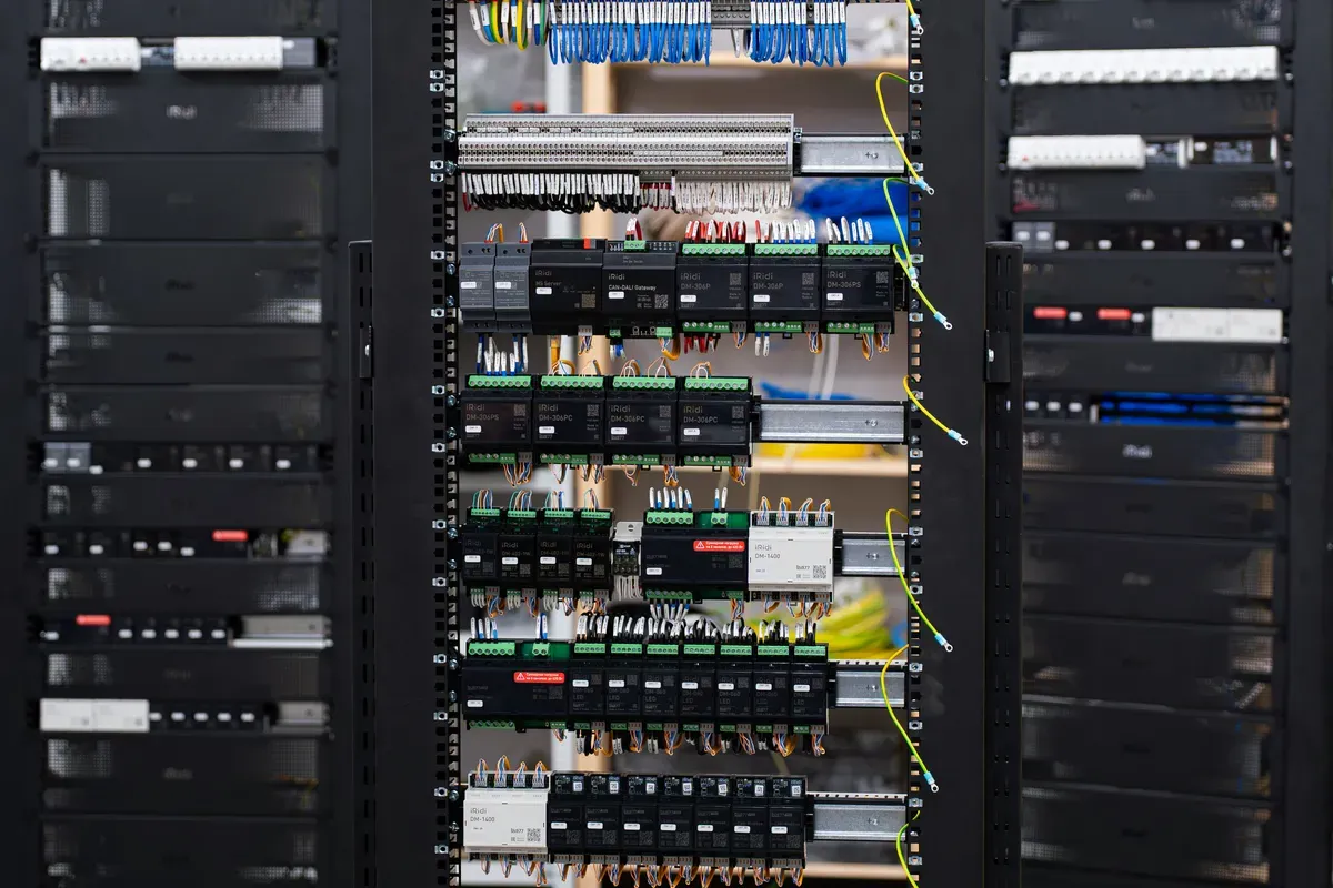An open control panel with wiring and circuit breakers