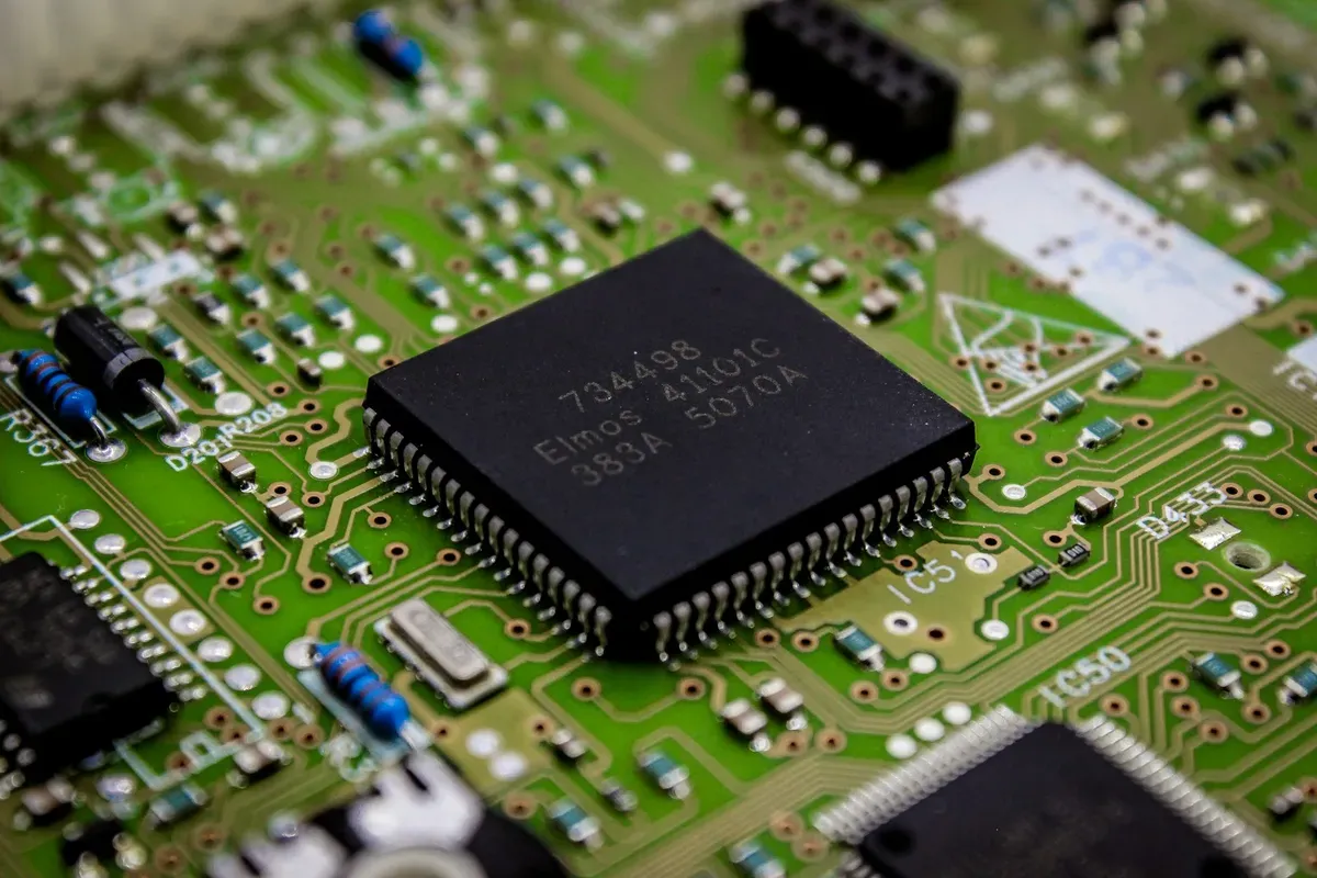 Close-up of a microcontroller on a printed circuit board, the layer where Aliro support is actually shipping