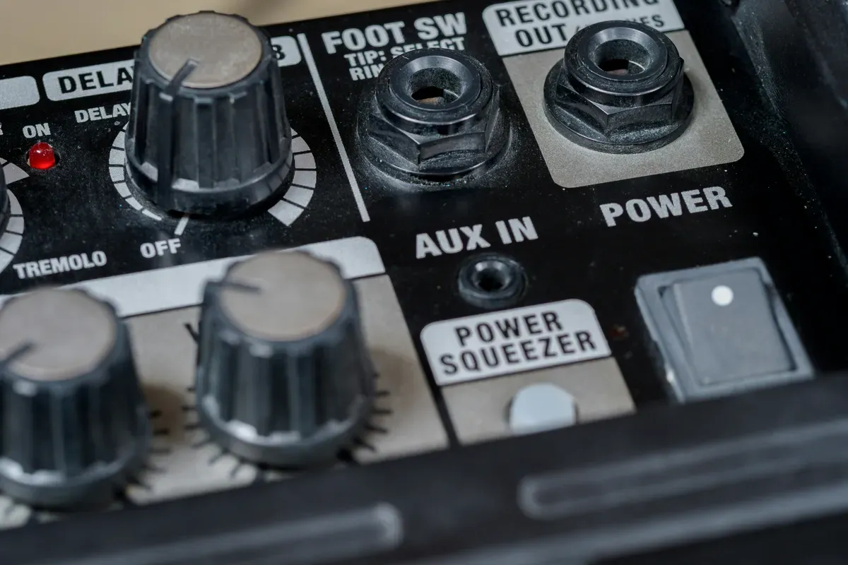 An audio mixer with rows of identical faders