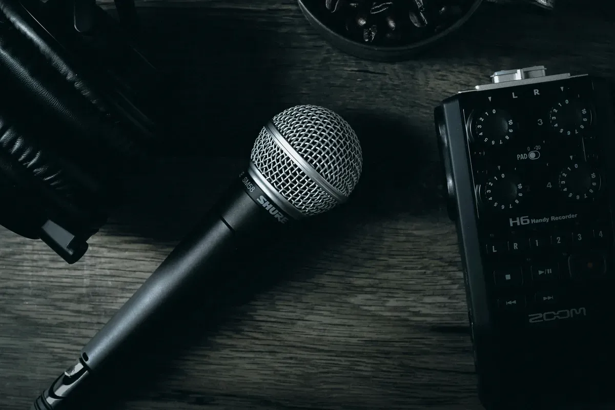 A black microphone shot against a plain ground