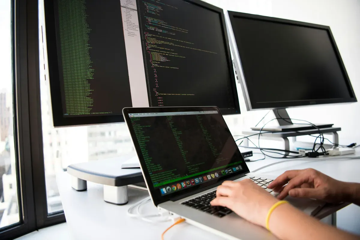 Hands at a laptop keyboard partway through a terminal session