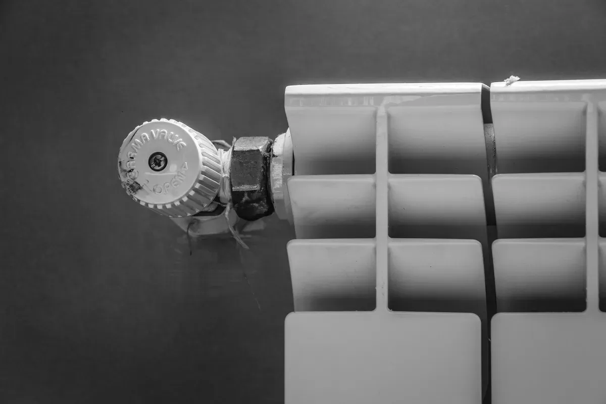 A close view of a radiator valve head, the part a smart head replaces