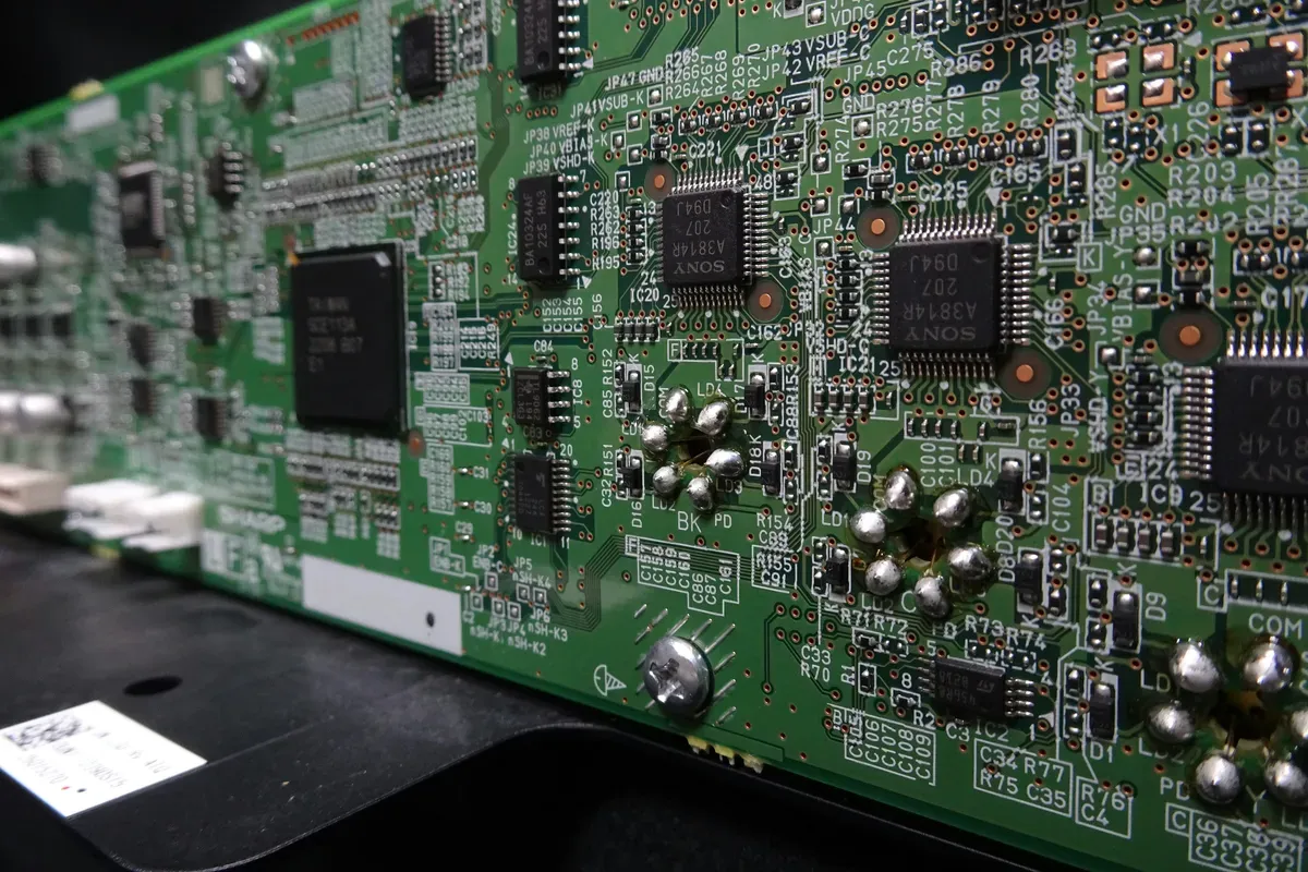 A close-up of a green electronic board