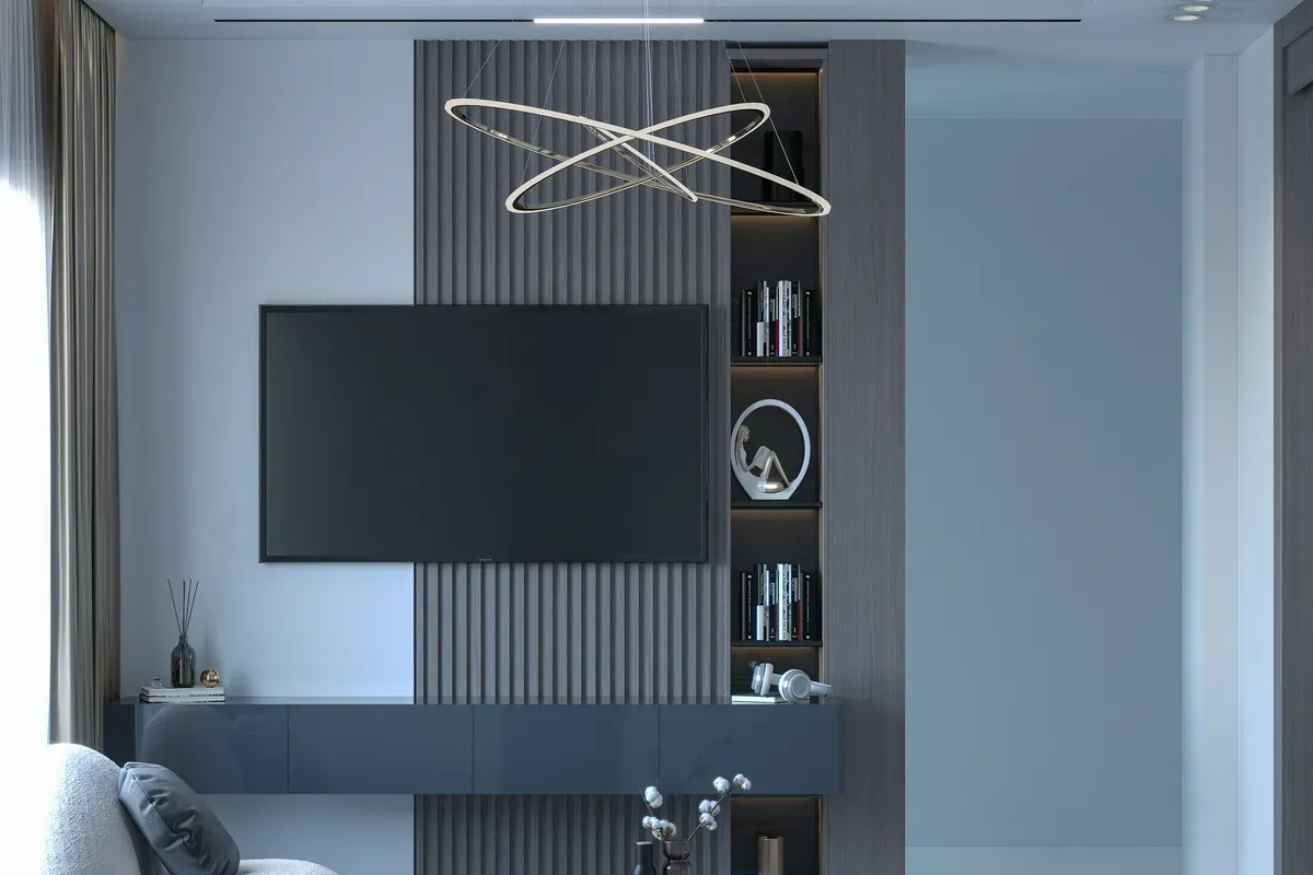 A wall mounted screen above a shelf, one room getting its own view