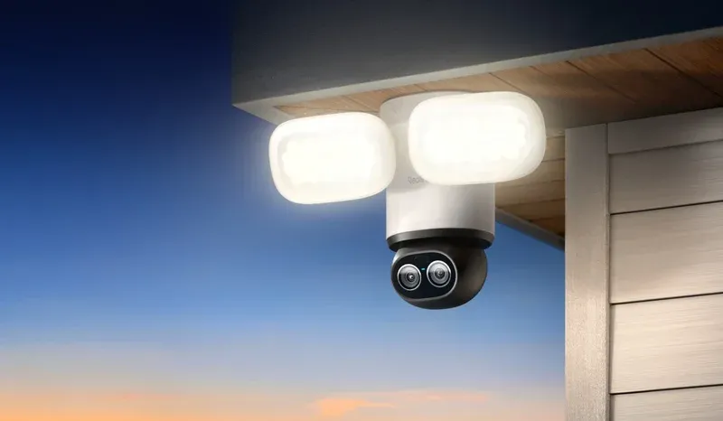 Reolink TrackFlex Floodlight close-up showing lens and pan tilt motor assembly