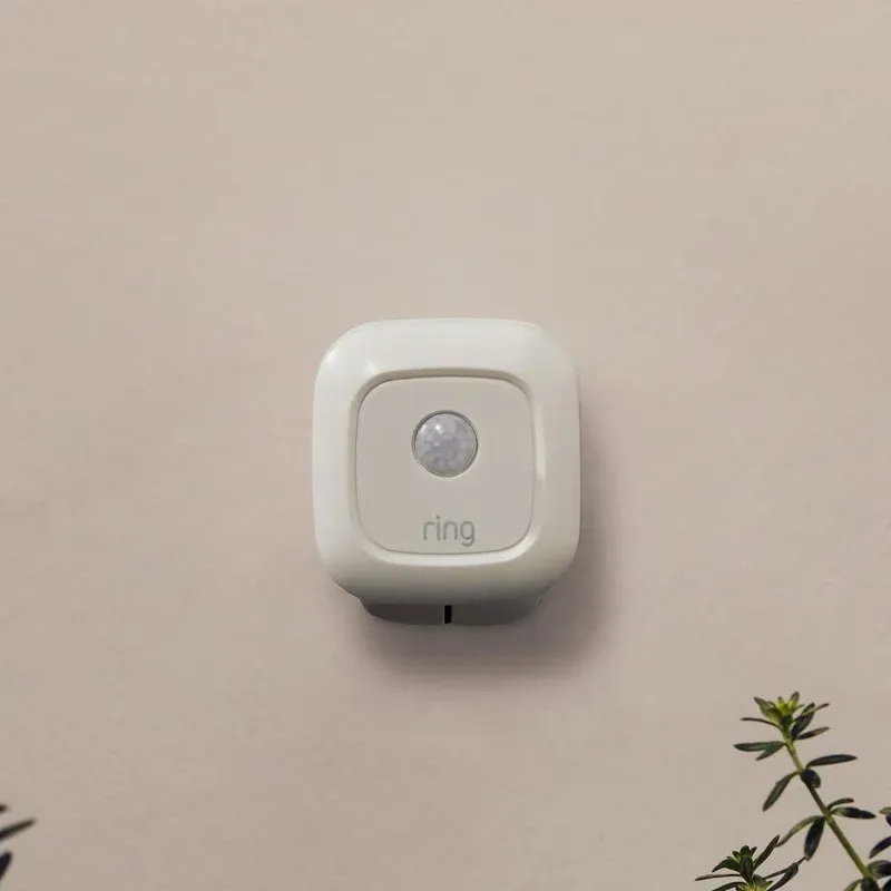 Ring Motion Sensor installed outdoors detecting approaching visitor