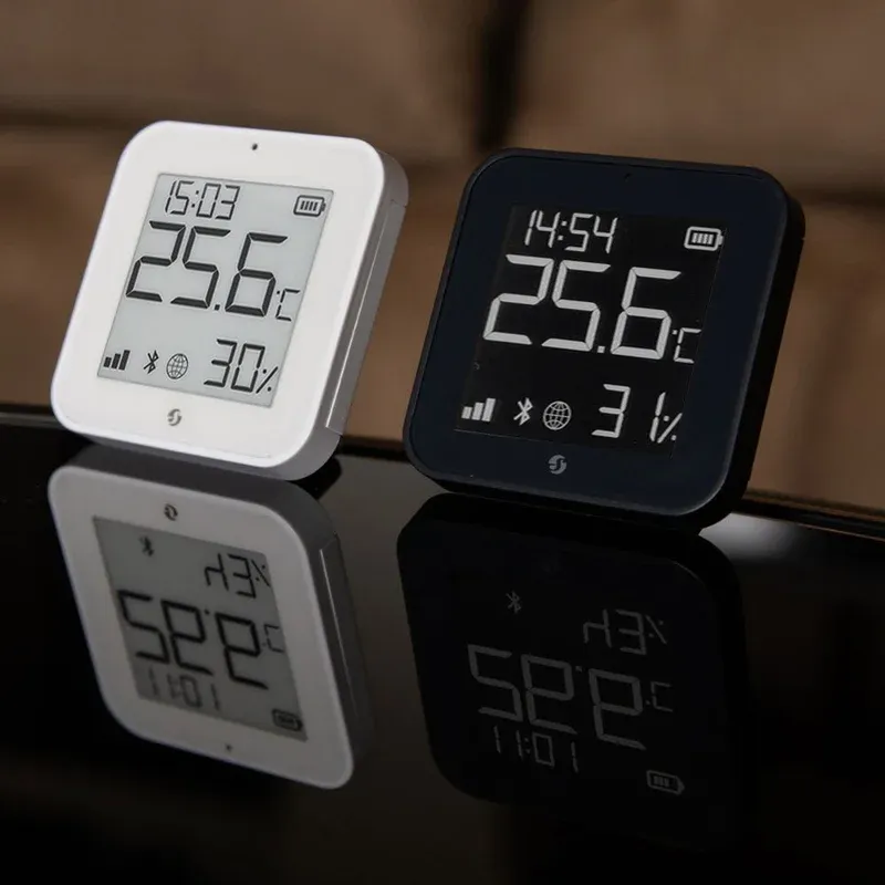 Shelly BLU H&T Display ZB on desk next to laptop showing sensor readings