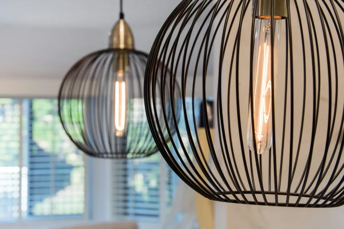 A pair of pendant lights hanging from a ceiling