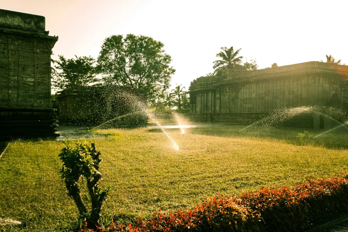 Sprinklers running over a lawn on a fixed schedule