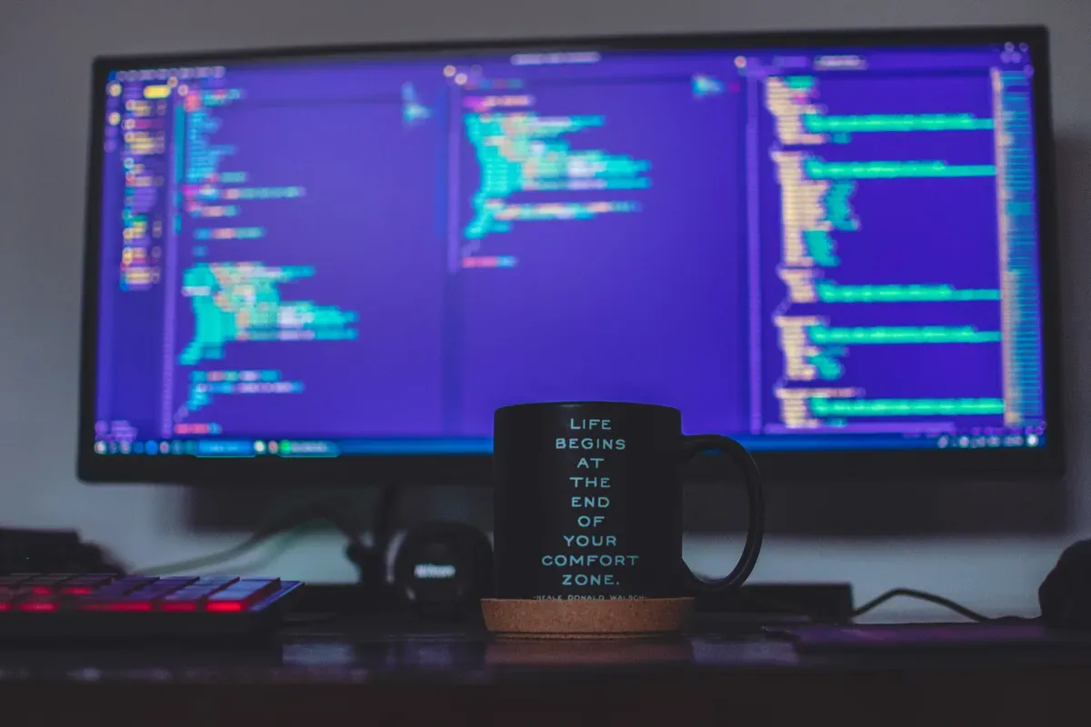 A wide monitor on a desk, the surface a dashboard card lands on