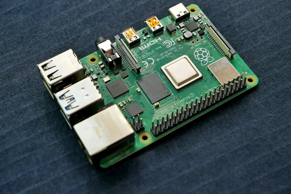The top side of a small single board computer on a dark surface