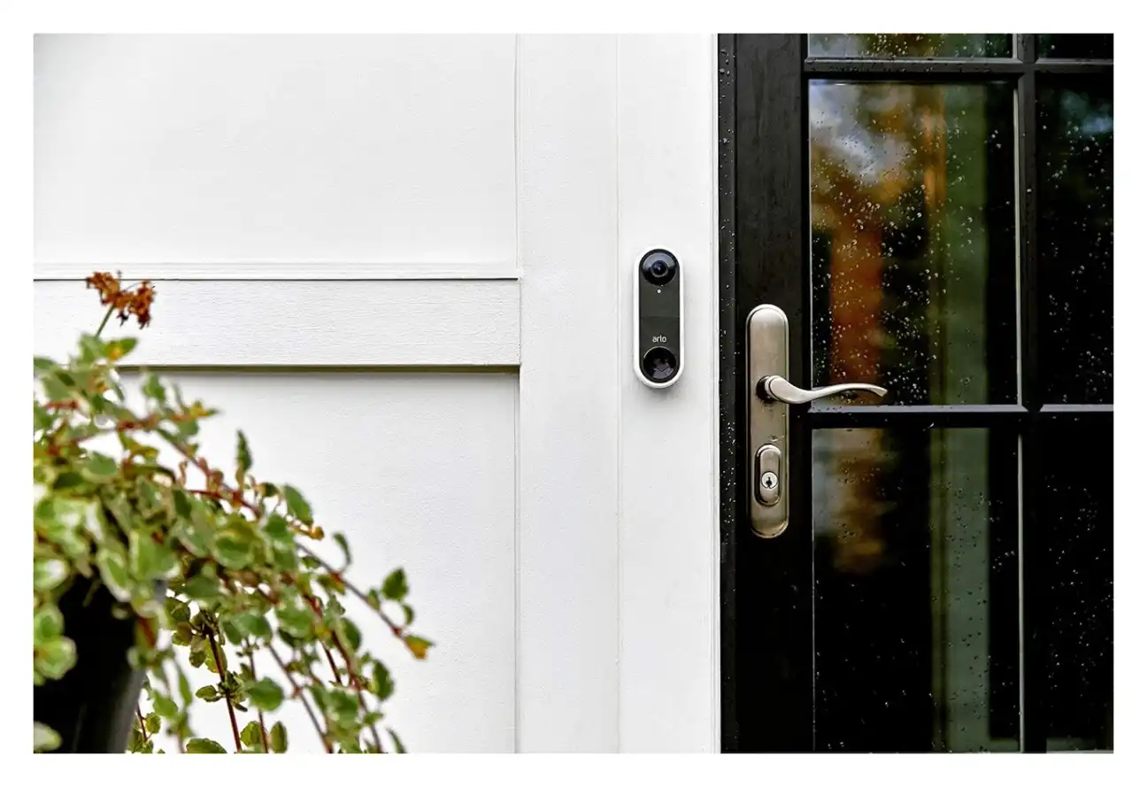 Doorbell installed beside modern entry door